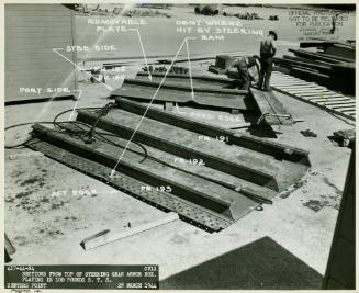 Black and white photograph of steel sections of the steering gear armor box during repairs