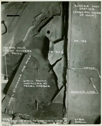 Black and white photograph of damage and repairs to starboard side void compartment on USS Intr…