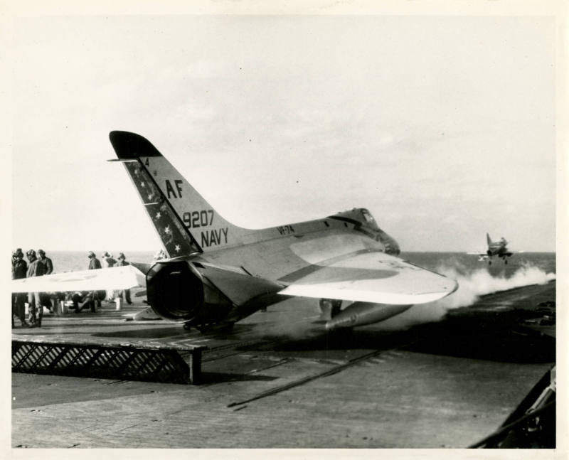 Black and white photograph of a FD4-1 Skyray on USS Intrepid's flight deck waiting to be launch…