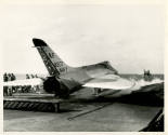 Black and white photograph of a FD4-1 Skyray on USS Intrepid's flight deck waiting to be launch…