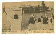 Printed newspaper clipping titled "Suez Shoe Shoo" with a black and white photograph of Intrepi…
