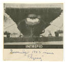 Printed newspaper clipping of a photograph of USS Intrepid at dock titled "Intrepid"