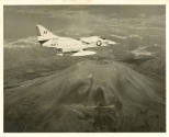 Printed black and white photograph of an A4D-2 Skyhawk in flight