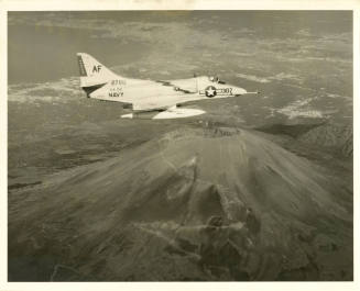 Printed black and white photograph of an A4D-2 Skyhawk in flight