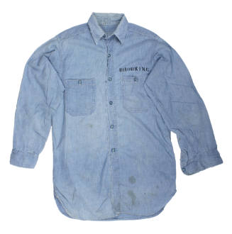 Front of blue long sleeve chambray shirt with "Brooking" over front pocket