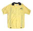 Front of yellow bowling shirt with blue collar and the word "Mike" above left pocket