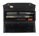 Black case for drafting set with divider, compass and screwdriver inside