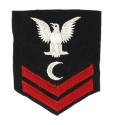 Dark blue U.S. Navy uniform patch with a white eagle, white crescent and two red chevrons