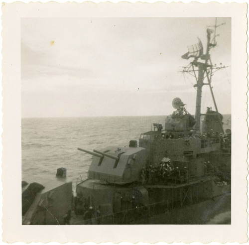 Printed black and white photograph of a destroyer at sea