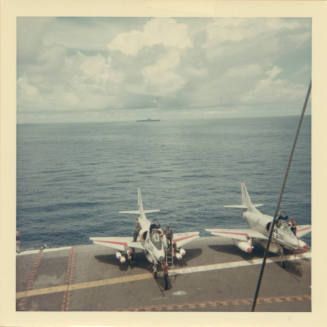 Color photograph of two A-4 Skyhawks on Intrepid's flight deck