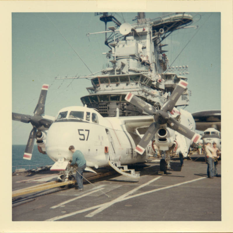 Color photograph of a C-2A Greyhound on Intrepid's flight deck