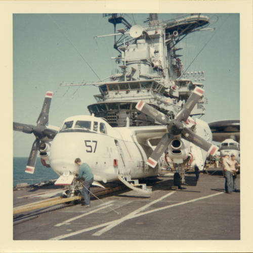 Color photograph of a C-2A Greyhound on Intrepid's flight deck
