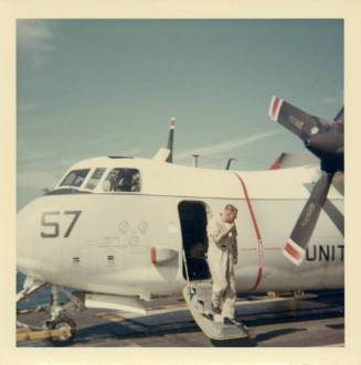 Color photograph of Grumman C-2A Greyhound on Intrepid's flight deck