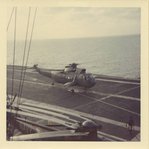 Color photograph of a Sikorsky SH-3A Sea King on Intrepid's flight deck