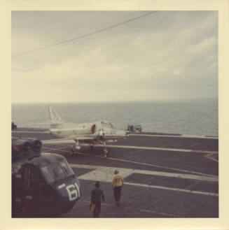 Color photograph of a A-4 Skyhawk on Intrepid's flight deck