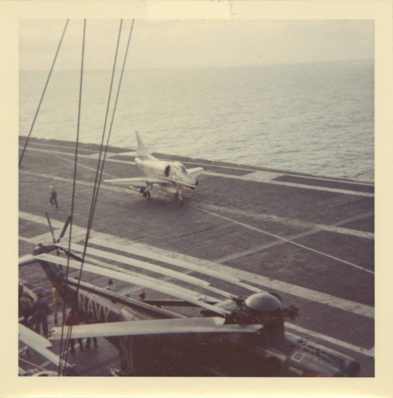 Color photograph of an A-4 Skyhawk on Intrepid's flight deck