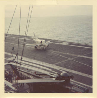 Color photograph of an A-4 Skyhawk on Intrepid's flight deck