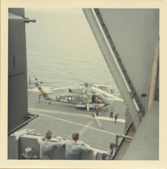 Color photograph of a Sea Sprite on Intrepid's flight deck