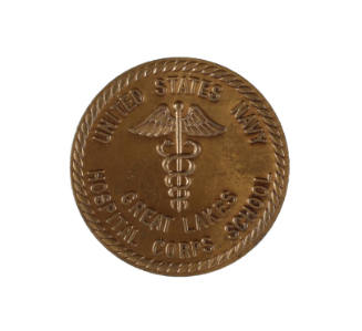 Bronze U.S. Navy Hospital Corps School award medal with staff and serpent insignia in center