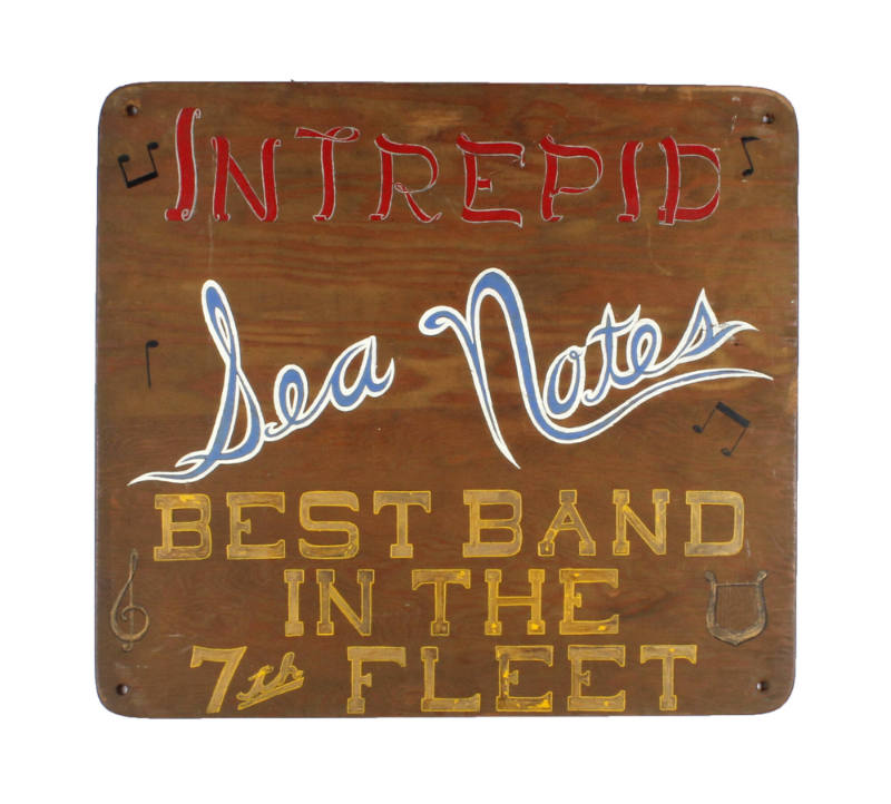 Square wooden sign for USS Intrepid's band, the Sea Notes, with red, blue and yellow hand-paint…