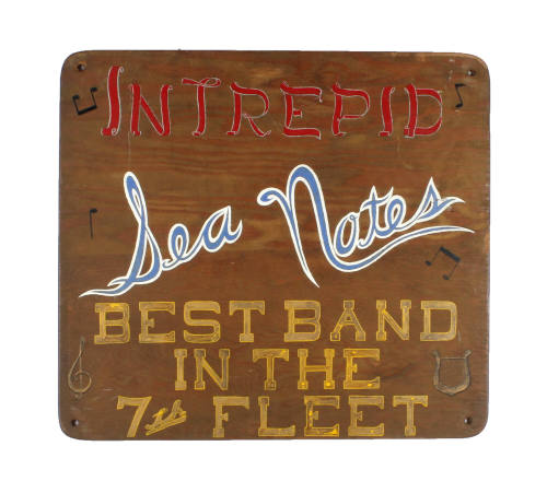 Square wooden sign for USS Intrepid's band, the Sea Notes, with red, blue and yellow hand-paint…