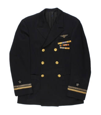 U.S. Navy dress blue officer jacket with ribbon bars, gold buttons and stripes at cuff