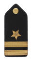 One U.S. Navy blue shoulder board with gold button, five pointed star and two stripes indicatin…