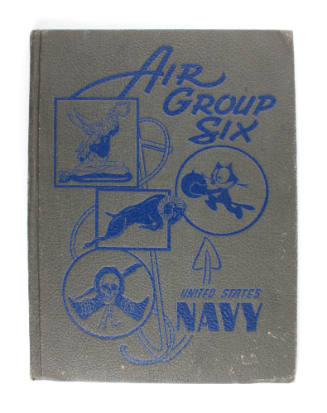 Gray hardcover Air Group Six yearbook with blue lettering and drawings of squadron art