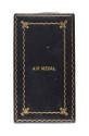 Cover of award box for Air Medal with gold waved design around edges