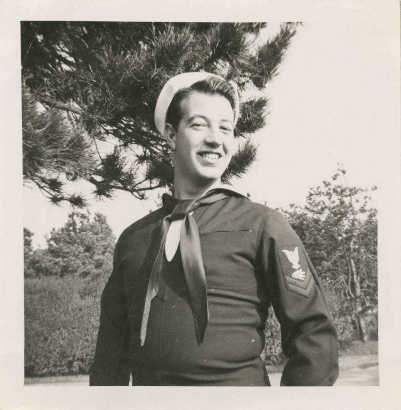 Printed black and white photograph of Gilbert J. Farmer in a sailor uniform