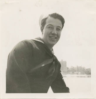 Printed black and white photograph of Gilbert J. Farmer wearing a sailor uniform