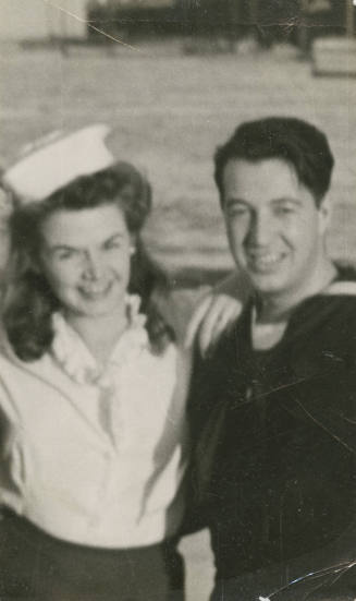 Printed black and white photograph of Gilbert J. Farmer and a woman wearing a sailor hat