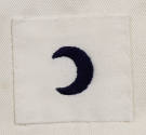 Black embroidered rating badge patch in the shape of a crescent or half moon