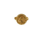 Small gold circular honorable service pin with image of eagle with outstretched wings in center