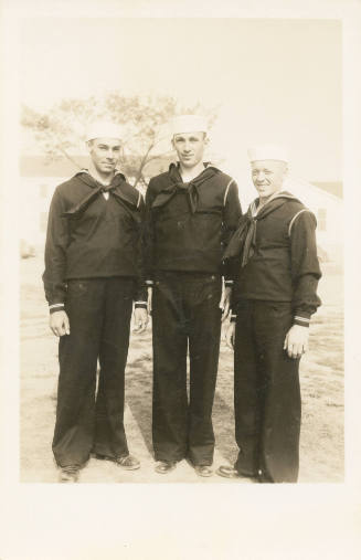 Printed black and white photograph of three enlisted sailors