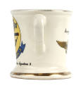 Side view of white ceramic mug with color designs on either side