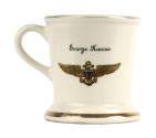 White ceramic mug with "George Konow" and naval aviator insignia