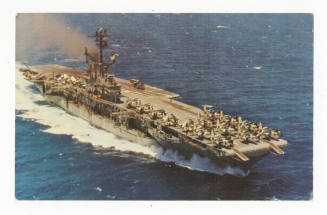 Printed color postcard of USS Intrepid at sea