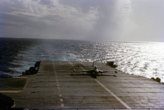 Printed color slide of a F2H-4 Banshee landing on Intrepid's flight deck