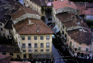 Printed color slide of a street in Pisa, Italy with buildings with terracotta roofs