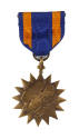 Air Medal with blue and orange striped ribbon and bronze 16-pointed circular medal depicting ea…