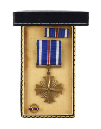 Distinguished Flying Cross medal in open presentation box with ribbon bar and lapel pin