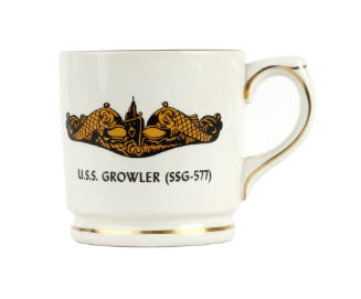 Mug with handle and image of submarine dolphins on one face with text "USS Growler (SSG-577)"