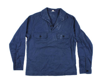 Front of light blue U.S. Navy utility jumper, with two pockets on the chest