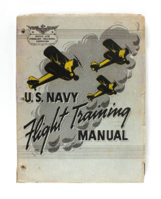 Gray hardcover book titled "U.S. Navy Flight Training Manual" with drawings of yellow aircraft