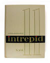 Cream hardcover 1960–1961 USS Intrepid cruise book with a large "11"