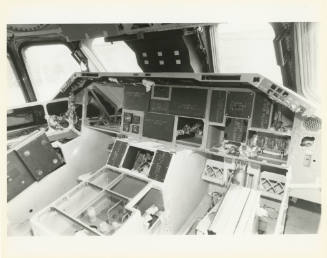 Printed black and white photograph of space shuttle Enterprise's cockpit with instruments remov…