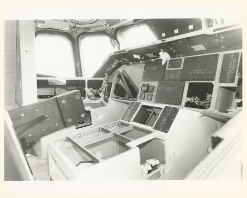 Printed black and white photograph of space shuttle Enterprise's cockpit with instruments remov…