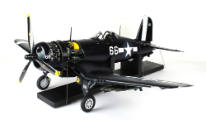 Angled side view of F4U Corsair model airplane, propeller visible at left