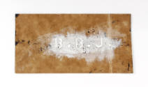 Brown stencil with white paint over letters "B. B. J."